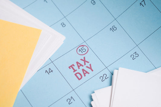 Calendar marked with tax day on the 15th.